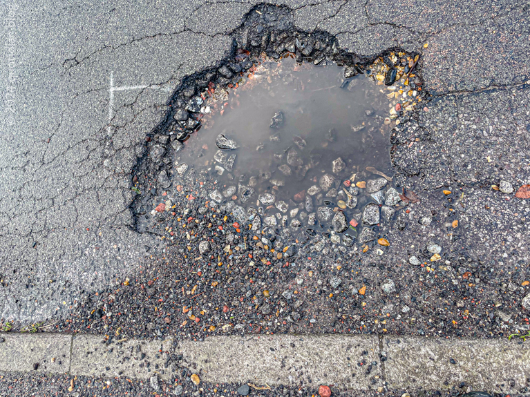 Saturday March 2nd (2024) our street pothole gets deeper align=
