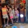 four girls listening